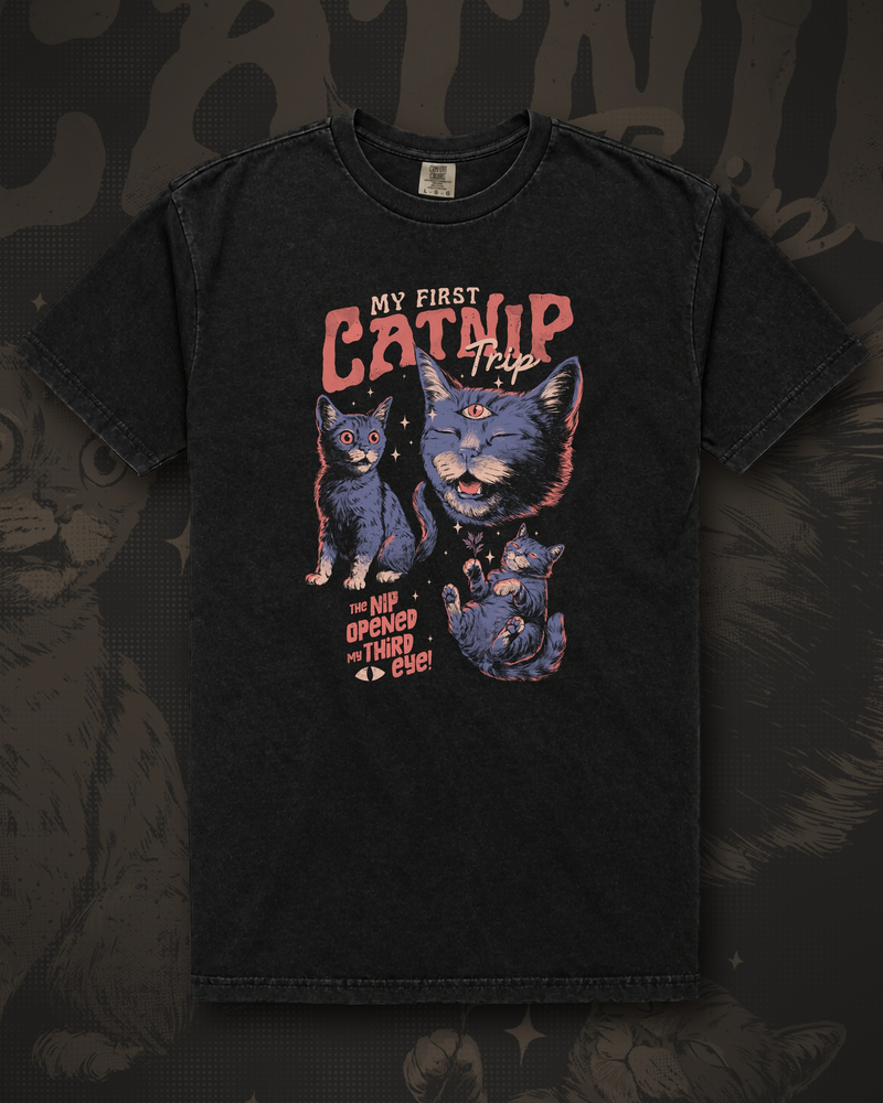 Three wide-eyed cats with a third eye opening above them, beneath the words My First Catnip Trip and the line The Nip Opened The Third graphic on black t-shirt – My First Catnip Trip Tee by CREEPTEE