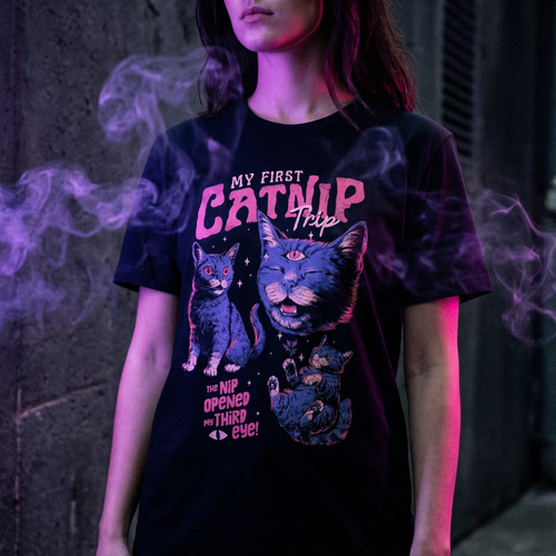 Three wide-eyed cats with a third eye opening above them, beneath the words My First Catnip Trip and the line The Nip Opened The Third graphic on black t-shirt, alternate view – My First Catnip Trip Tee by CREEPTEE