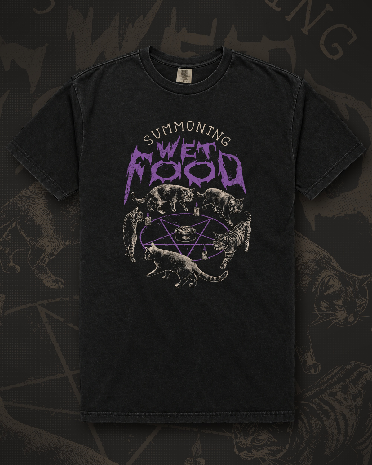 Black t-shirt printed with five cats circling a purple pentagram and candles around a can of wet food under dripping purple lettering reading Summoning Wet Food
