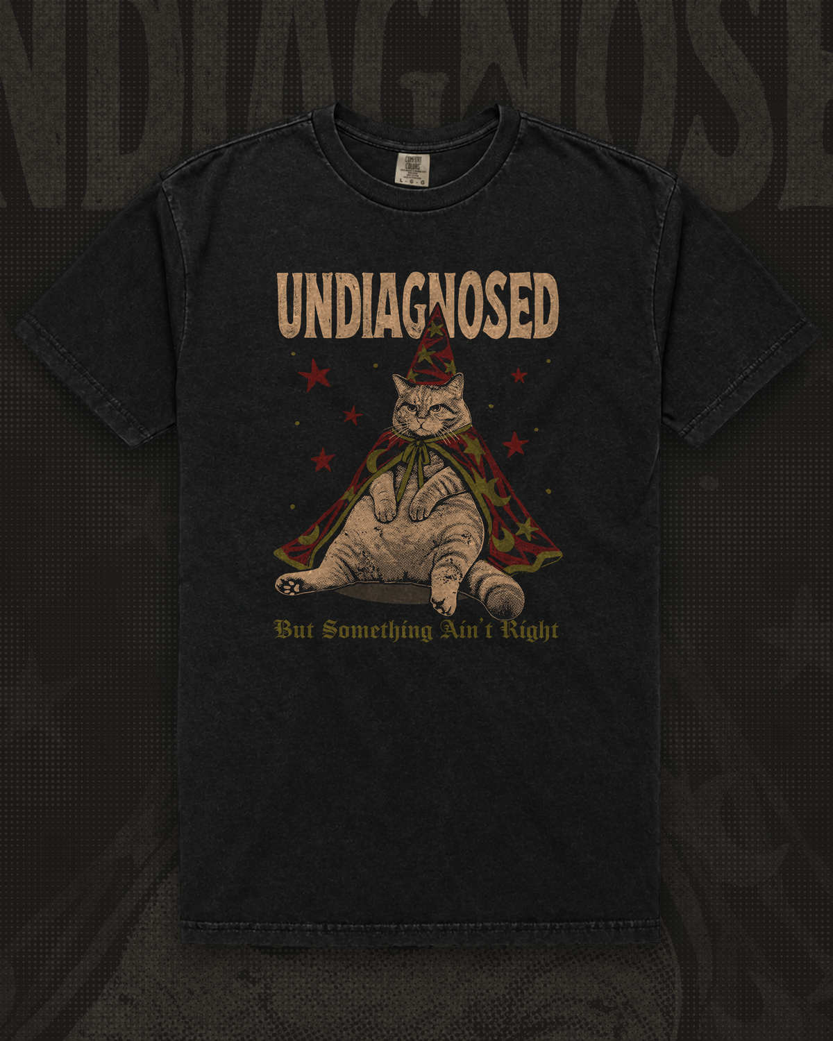 Chubby cat in a red star-covered wizard hat and cape under the word Undiagnosed graphic on black t-shirt – Undiagnosed But Something Ain't Right Tee by CREEPTEE